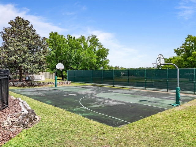 view of basketball court featuring community basketball court and fence