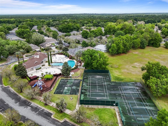 birds eye view of property featuring a view of trees