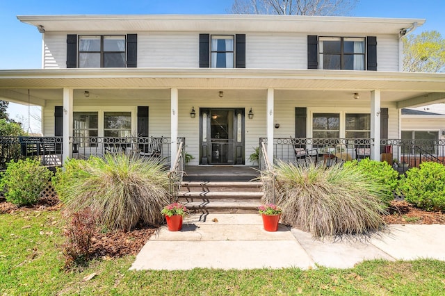 view of front of home featuring covered porch