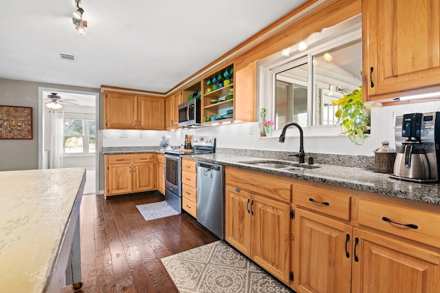 kitchen featuring visible vents, a sink, dark wood finished floors, appliances with stainless steel finishes, and open shelves