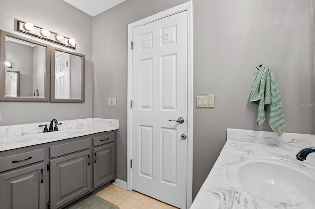 bathroom with vanity and tile patterned floors