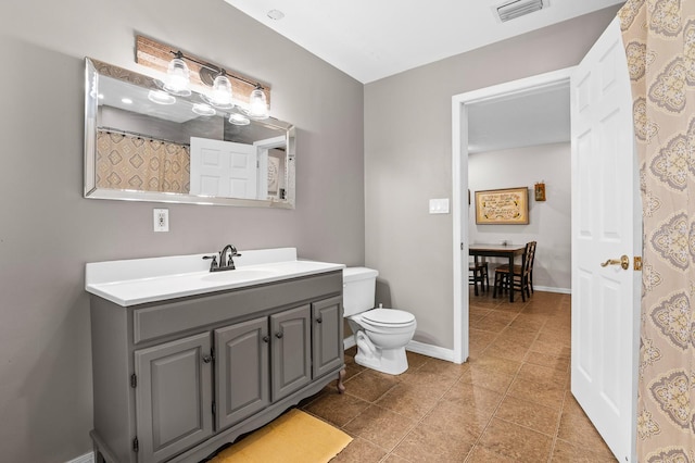 full bath with tile patterned floors, visible vents, toilet, baseboards, and vanity