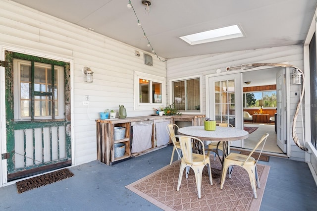 sunroom / solarium featuring a skylight