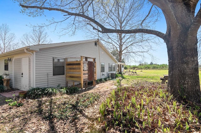 view of property exterior with central AC unit