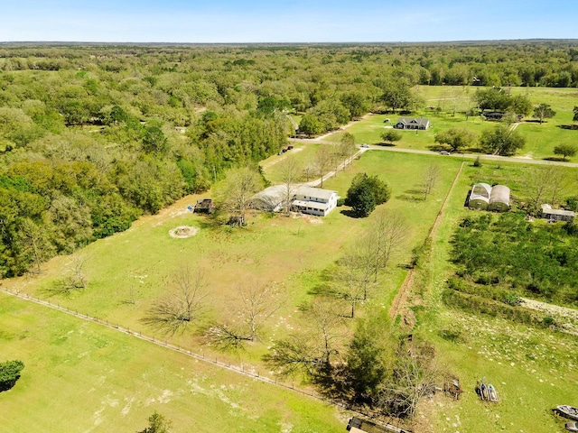 birds eye view of property with a rural view and a forest view