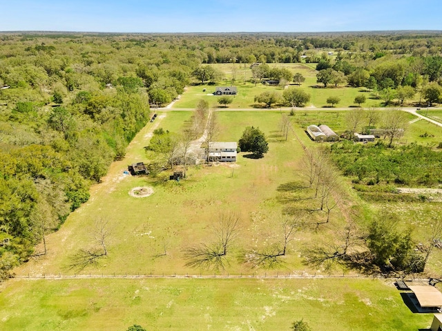 aerial view with a rural view and a wooded view