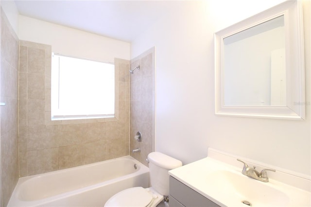 bathroom featuring vanity, toilet, and shower / bathtub combination