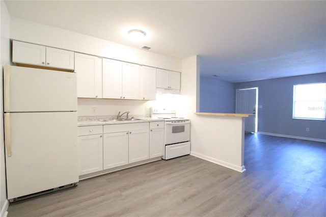 kitchen featuring white cabinetry, white appliances, light countertops, and a sink