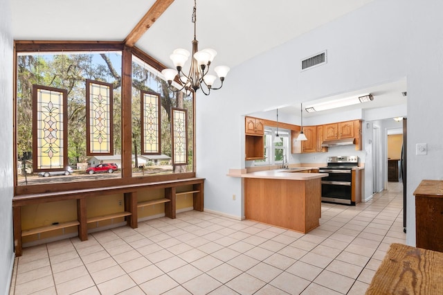 kitchen with visible vents, under cabinet range hood, double oven range, a peninsula, and light tile patterned floors