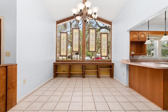 unfurnished dining area featuring vaulted ceiling, a notable chandelier, light tile patterned floors, and baseboards