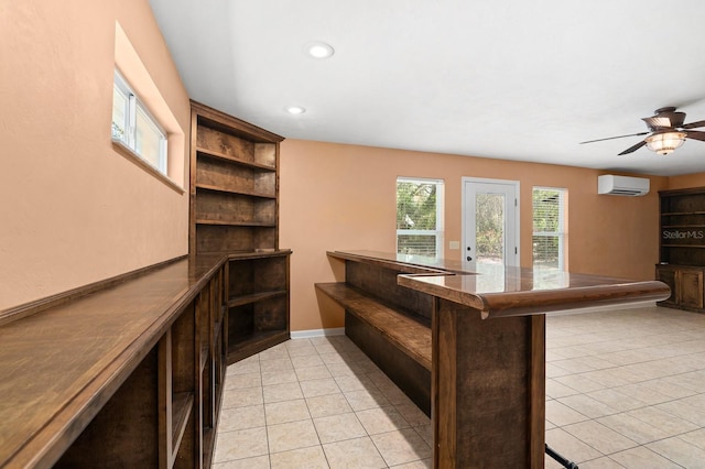 bar with a ceiling fan, baseboards, a wall mounted AC, light tile patterned flooring, and recessed lighting