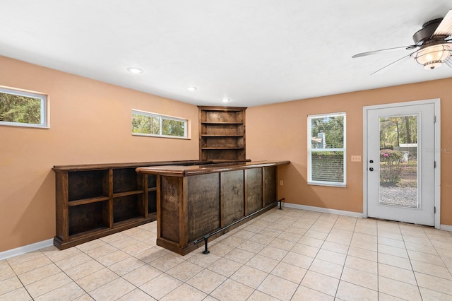 bar with light tile patterned floors, recessed lighting, baseboards, and ceiling fan