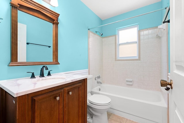 bathroom with tile patterned floors, shower / washtub combination, toilet, and vanity