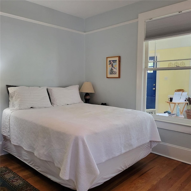 bedroom with wood finished floors