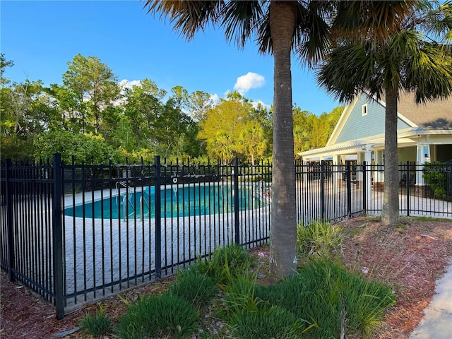 view of swimming pool featuring a fenced in pool and fence