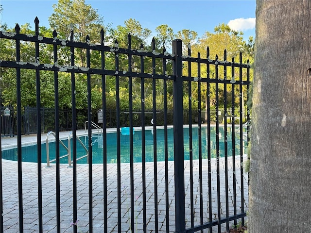 view of gate featuring fence