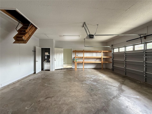 garage with baseboards and a garage door opener