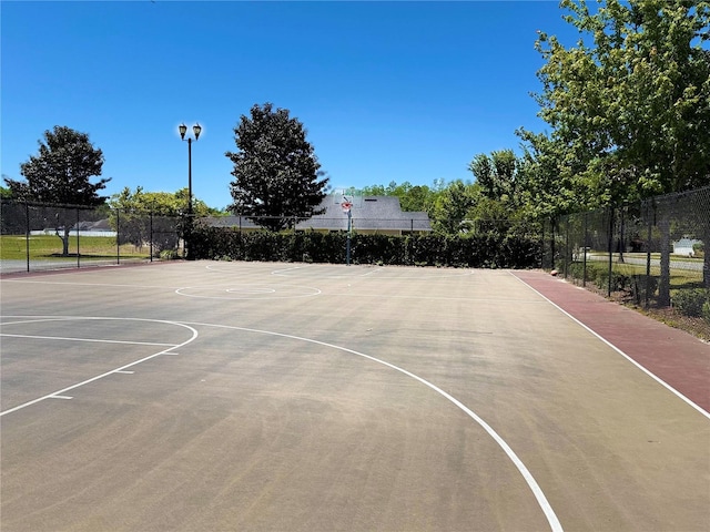 view of sport court featuring community basketball court and fence