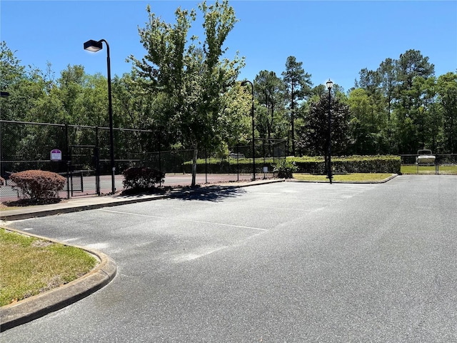 view of street with curbs and street lights