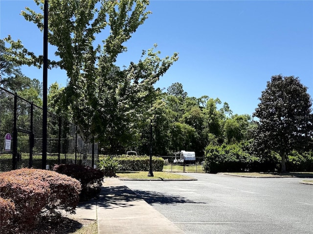 view of road with sidewalks and curbs