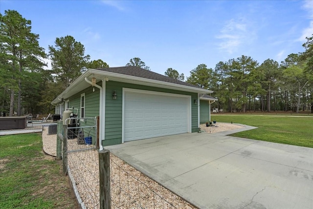 garage with concrete driveway