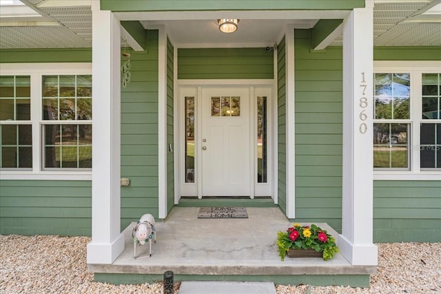 doorway to property with covered porch