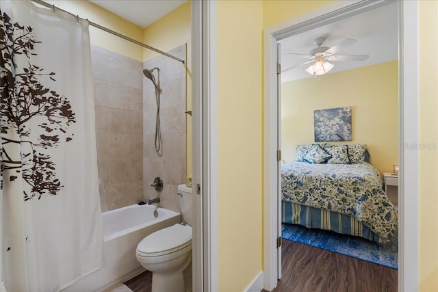 ensuite bathroom featuring ceiling fan, wood finished floors, toilet, and ensuite bath