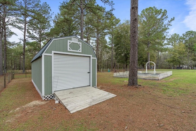 view of outbuilding with an outbuilding and fence