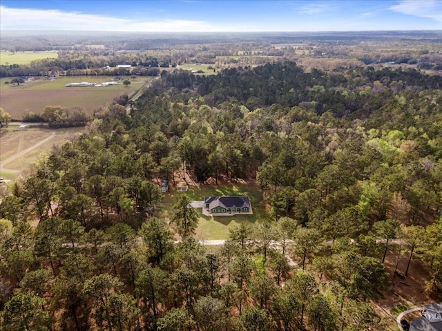 birds eye view of property with a rural view and a view of trees