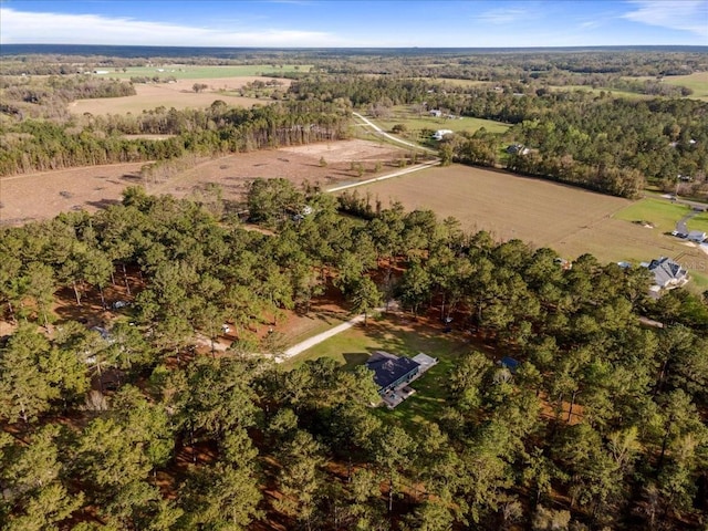 birds eye view of property with a rural view