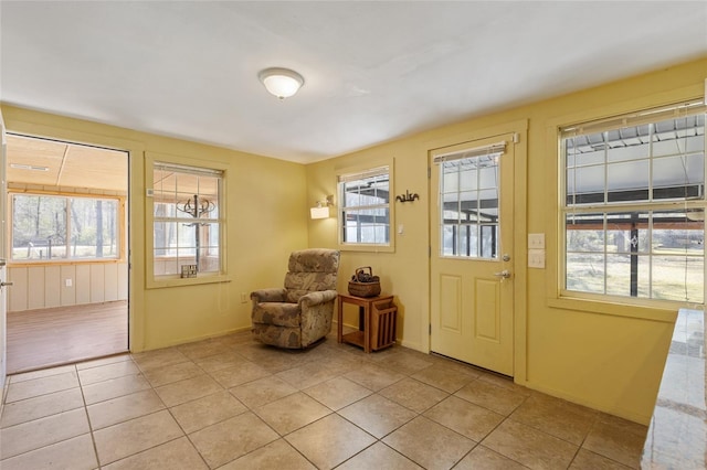 foyer entrance with light tile patterned floors