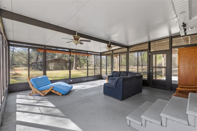 sunroom / solarium featuring ceiling fan