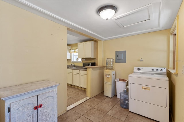 clothes washing area featuring attic access, electric panel, washer / clothes dryer, light tile patterned flooring, and a sink