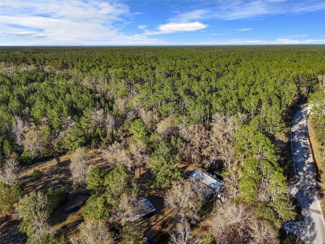 aerial view featuring a view of trees