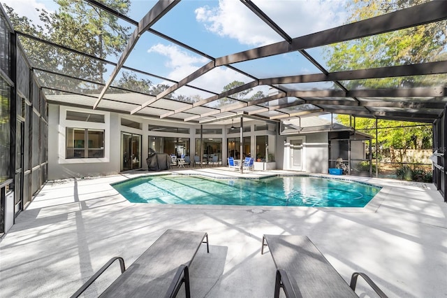 outdoor pool with a patio area and a lanai