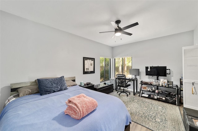 bedroom with wood finished floors and a ceiling fan