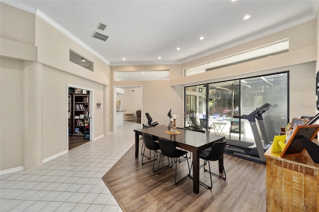 dining room with light tile patterned floors, baseboards, recessed lighting, and crown molding