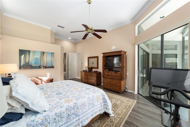 bedroom featuring wood finished floors, baseboards, visible vents, ornamental molding, and access to outside