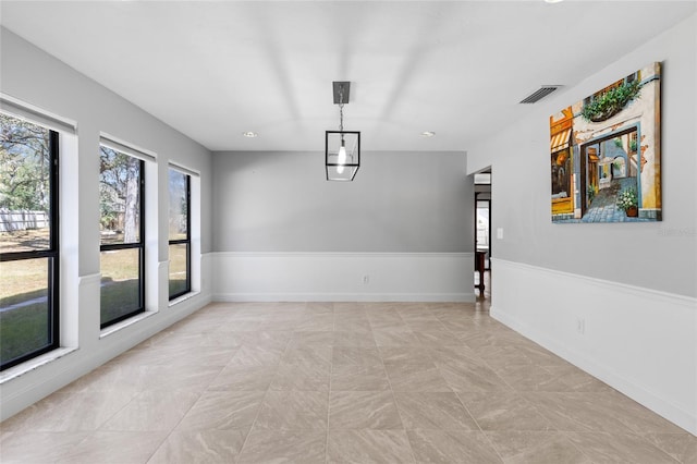 unfurnished room with visible vents, recessed lighting, and baseboards