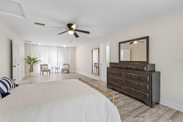 bedroom with light wood-style flooring, baseboards, visible vents, and ceiling fan