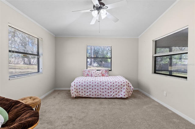 carpeted bedroom with baseboards, multiple windows, and ornamental molding