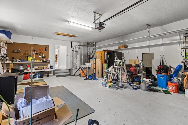 garage with gas water heater and a garage door opener