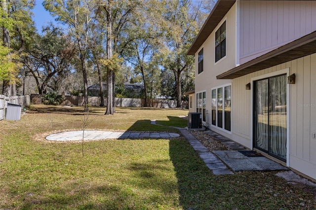 view of yard with a patio, central AC unit, and a fenced backyard