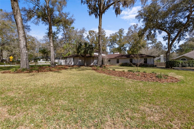 view of yard with fence