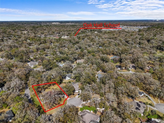 birds eye view of property with a forest view