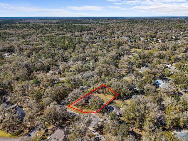 drone / aerial view with a view of trees