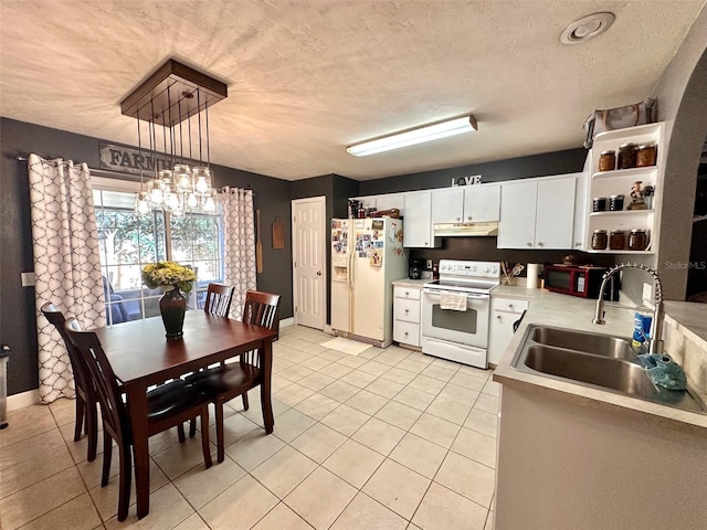 kitchen with a sink, under cabinet range hood, light countertops, white appliances, and open shelves