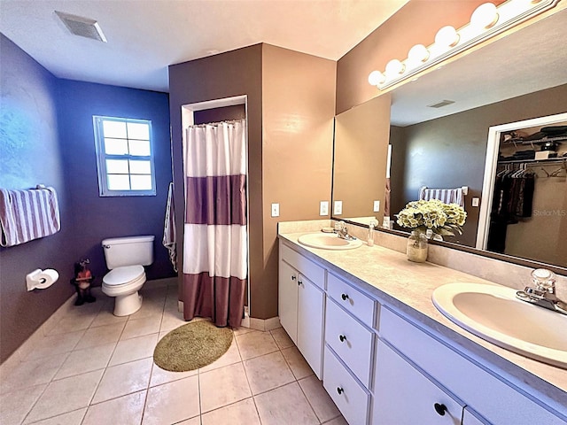 full bath featuring visible vents, toilet, and a sink