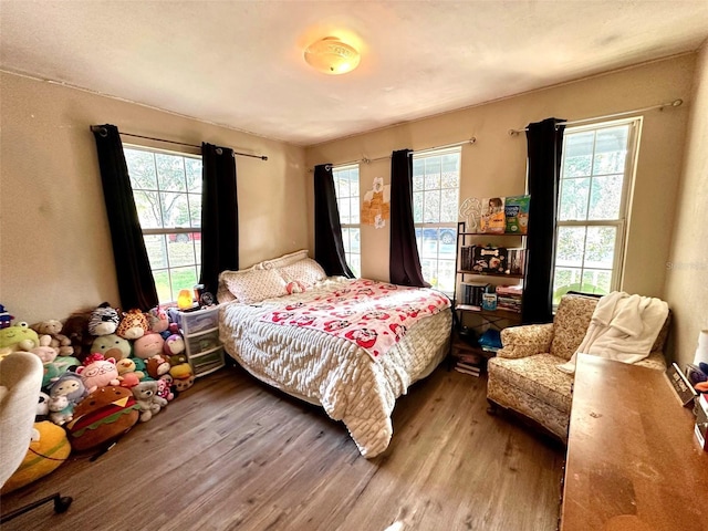 bedroom featuring wood finished floors