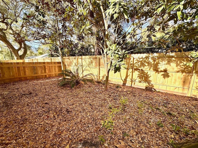 view of yard featuring a fenced backyard